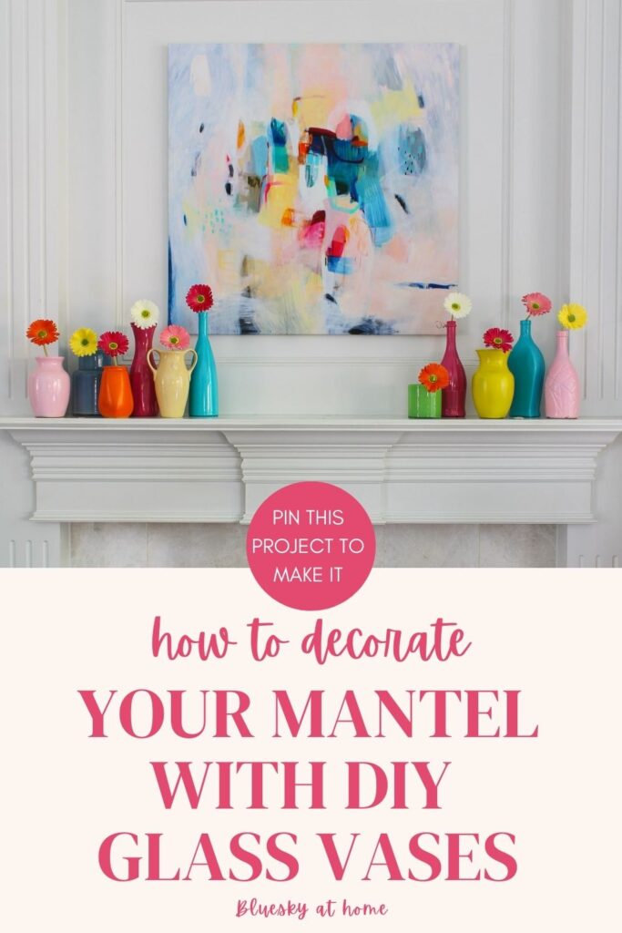 colored glass painted vases with zinnias on mantel