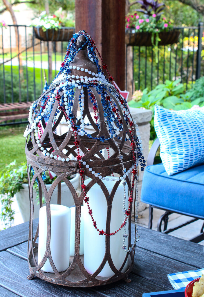 metal lantern decorated in red, white, blue
