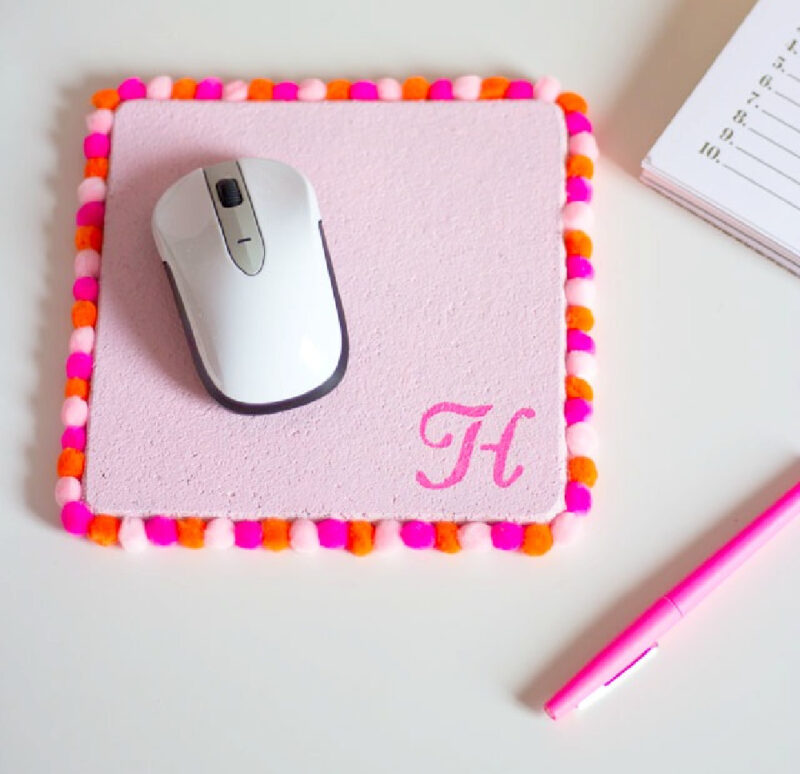 pink DIY mouse pad with pom poms