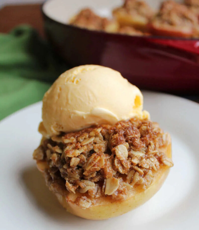 mini apple crisp baked apples with a scoop of ice cream on top