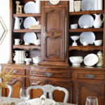 hutch decorated with white and neutral dishes and accessories graphic