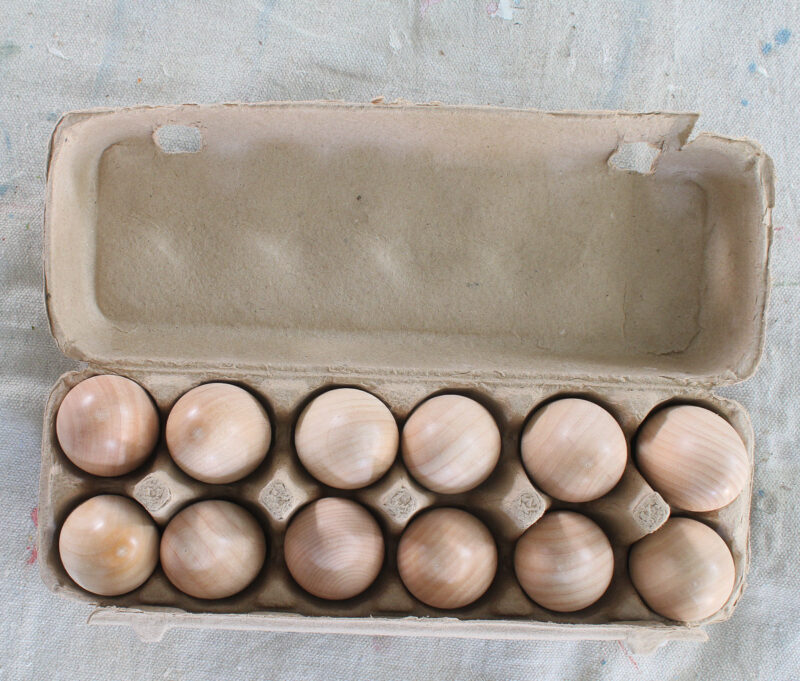 wood eggs in carton