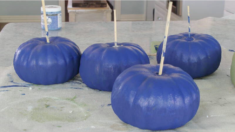 painting navy faux pumpkins