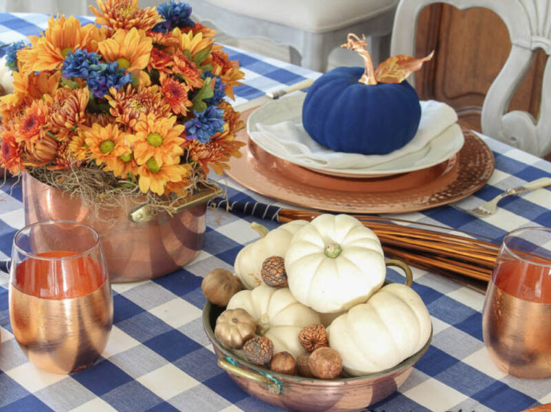 blue painted pumpkin on tablescape