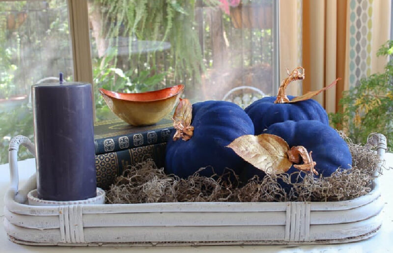 blue-painted pumpkin on breakfast vignette