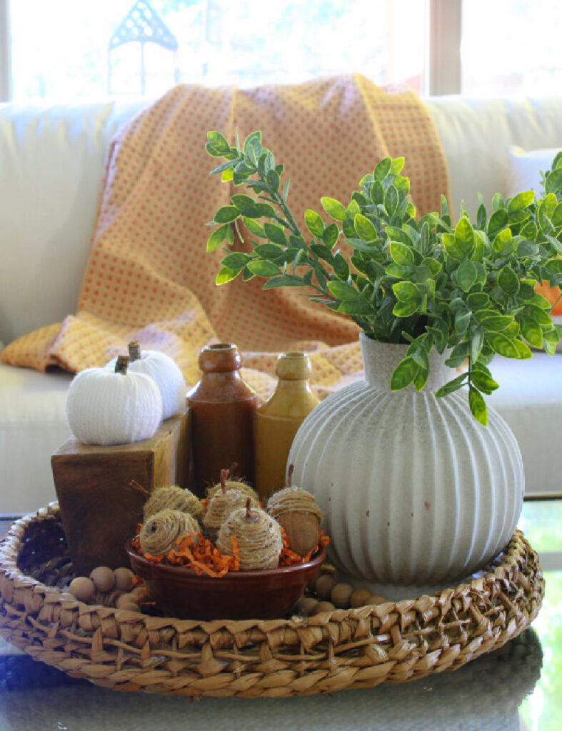 faux DIY acorns for fall decorating in basket on table