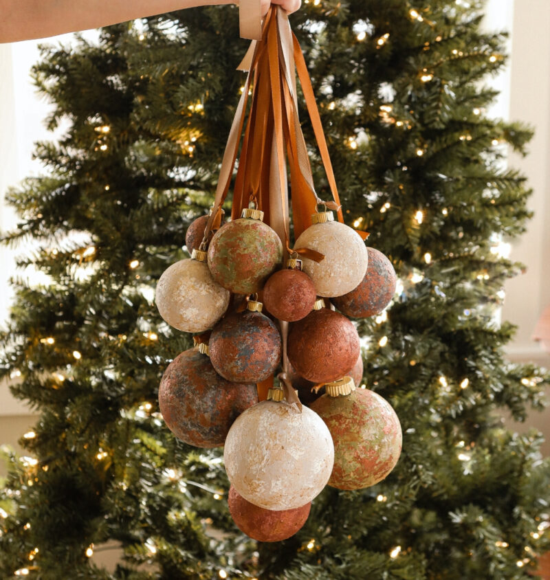 rusty vintage ornaments hanging on lighted tree