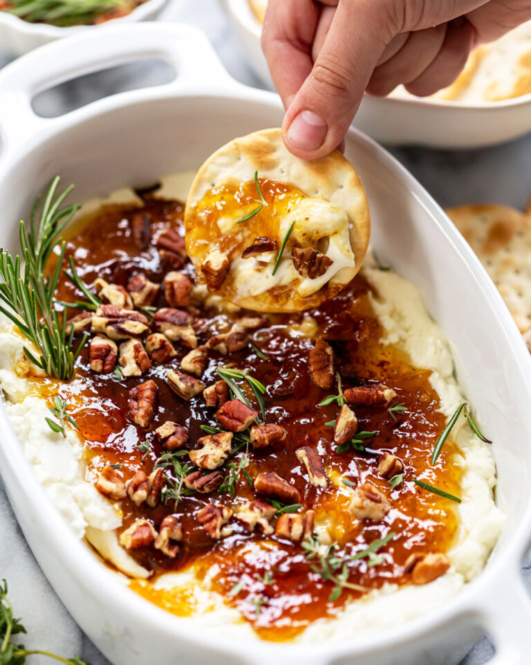 goat cheese and jam dip appetizer in white dish