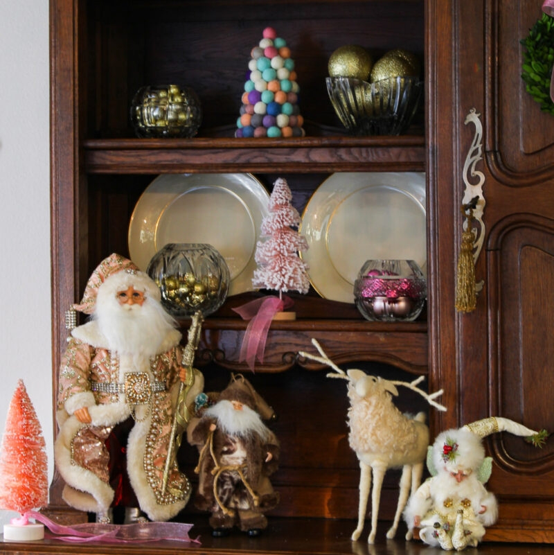 pink santa and reindeer on hutch with china