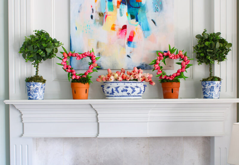 topiaries and tulips on mantel
