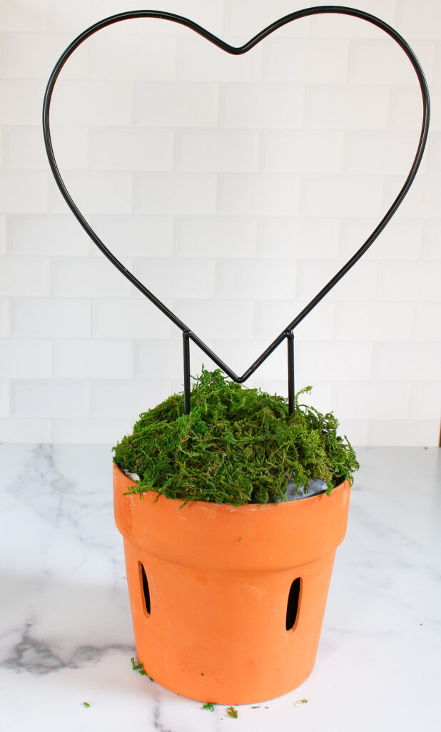 heart-shaped wire form in planter