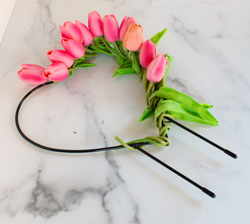 wrapping tulips and stems around wire form
