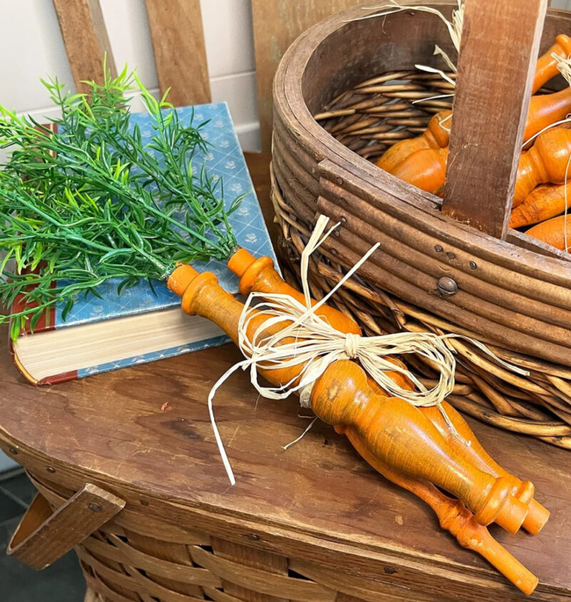 orange carrots made from wood spindles tied with raffia