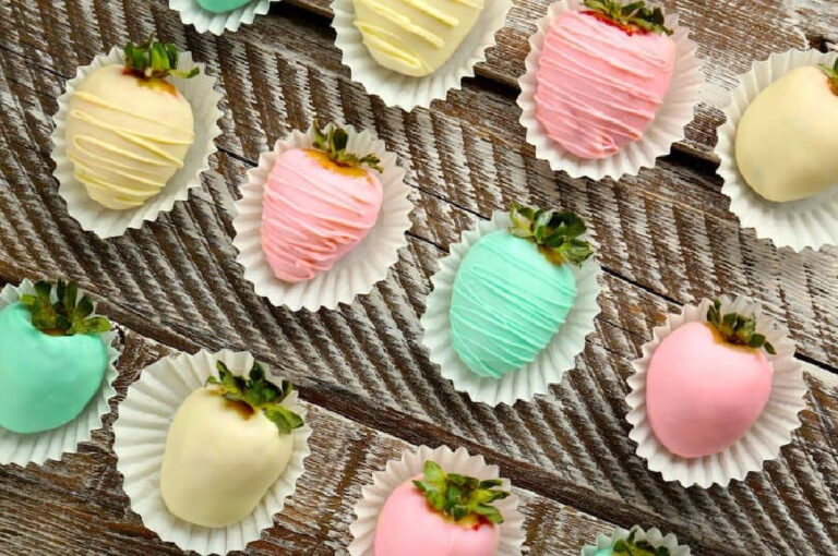 pastel iced strawberries in pinks, blues, yellows