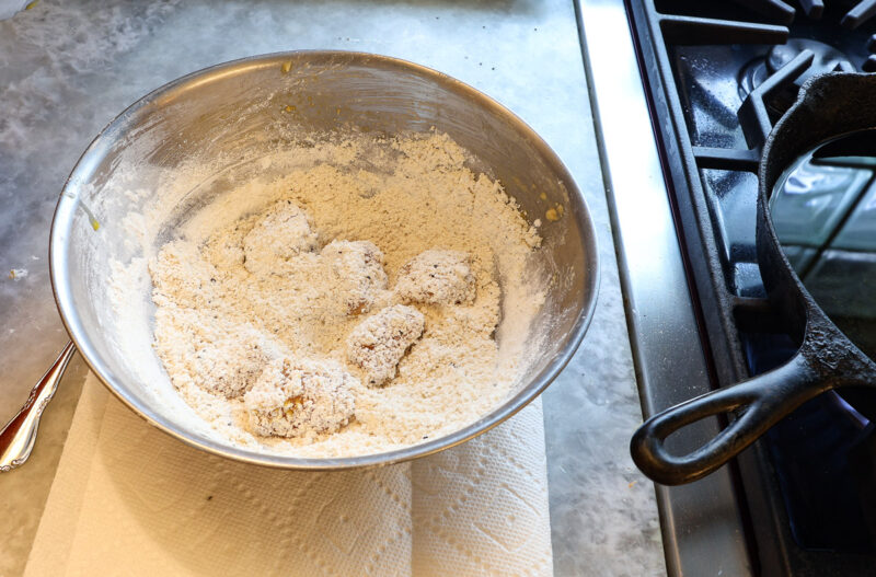 chicken cubes in bowl of batter