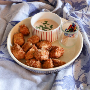 crispy fried bang bang chicken on blue dish towel