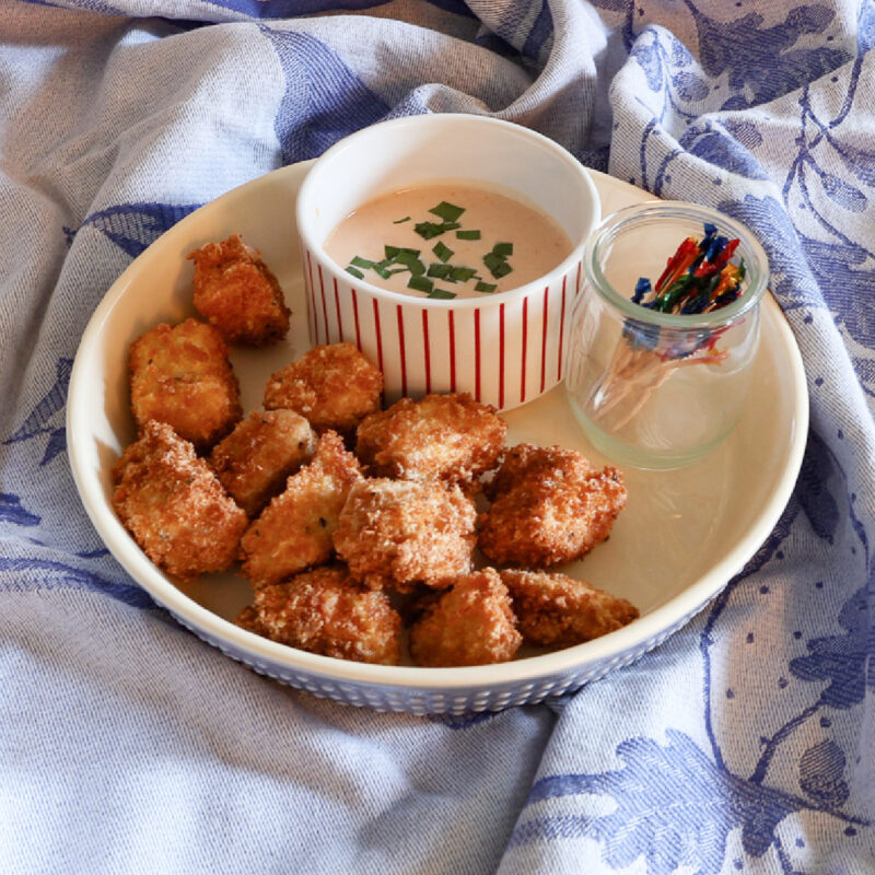 crispy fried bang bang chicken on blue dish towel