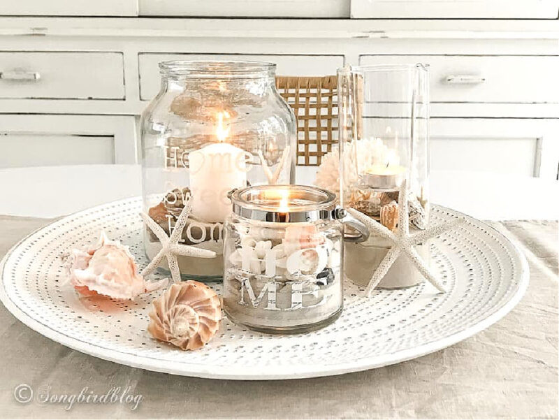 DIY beach lantern centerpiece with glass jars and sand