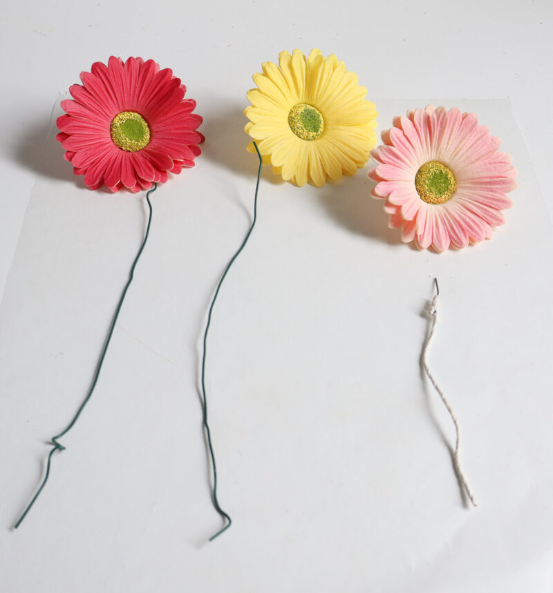 three faux flowers with florist wire