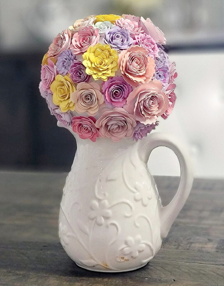 pretty paper flowers in white pitcher