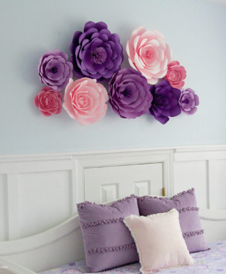 large pink and purple paper flowers as wall art