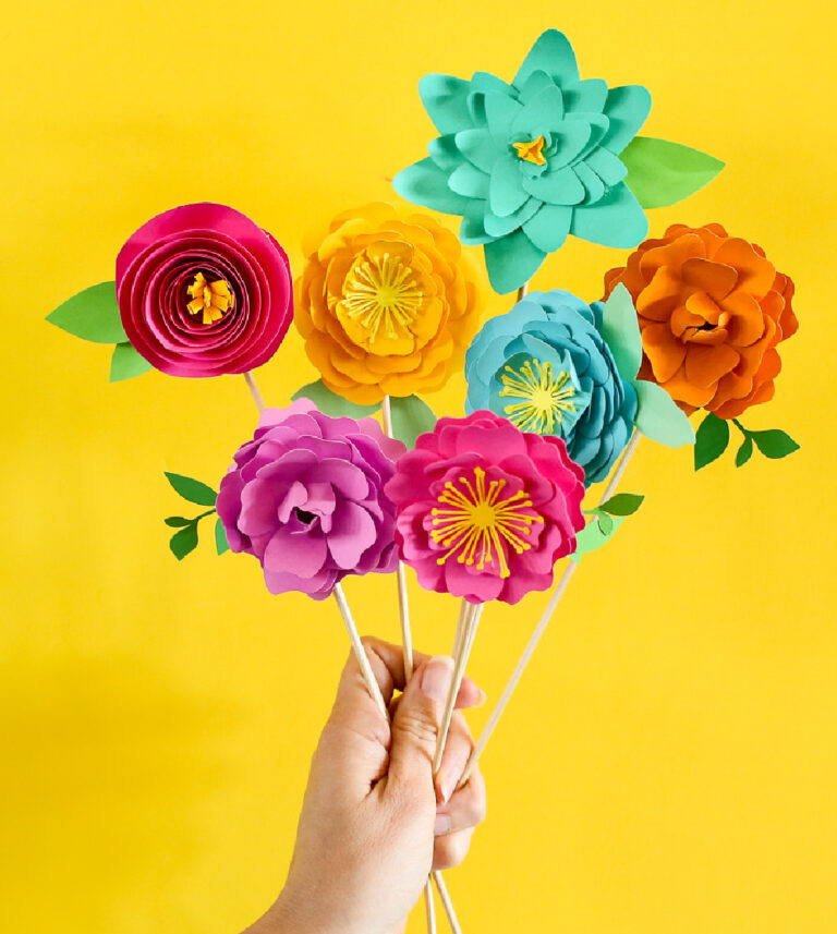 multi-colored paper flowers held by a hand