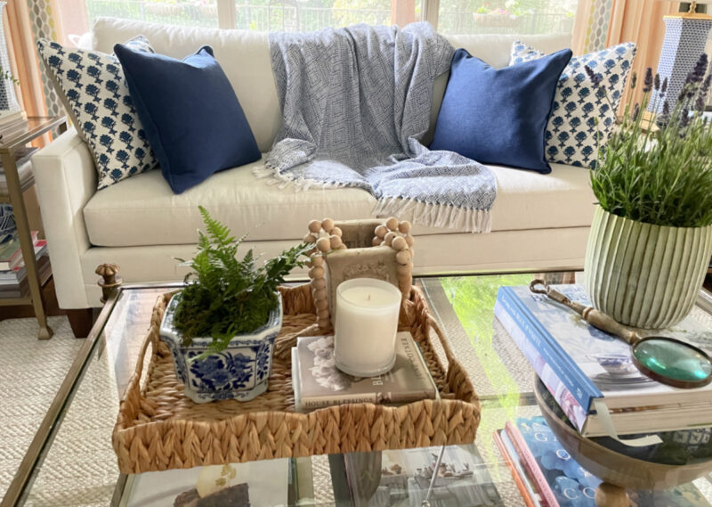 living room sofa with summer coffee table in whites and blues