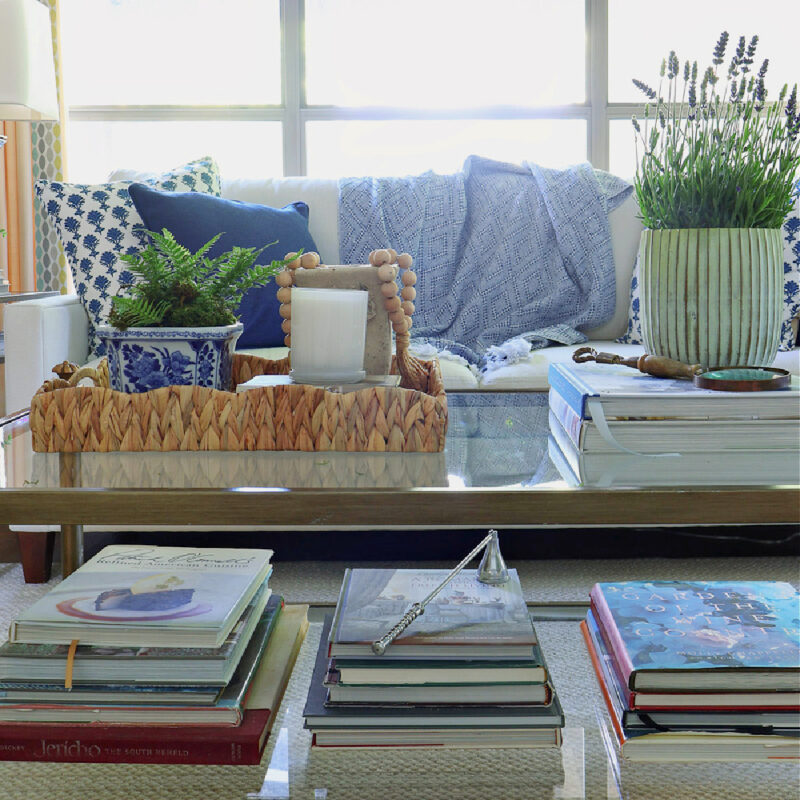 summer coffee table styled with greenery and vintage finds