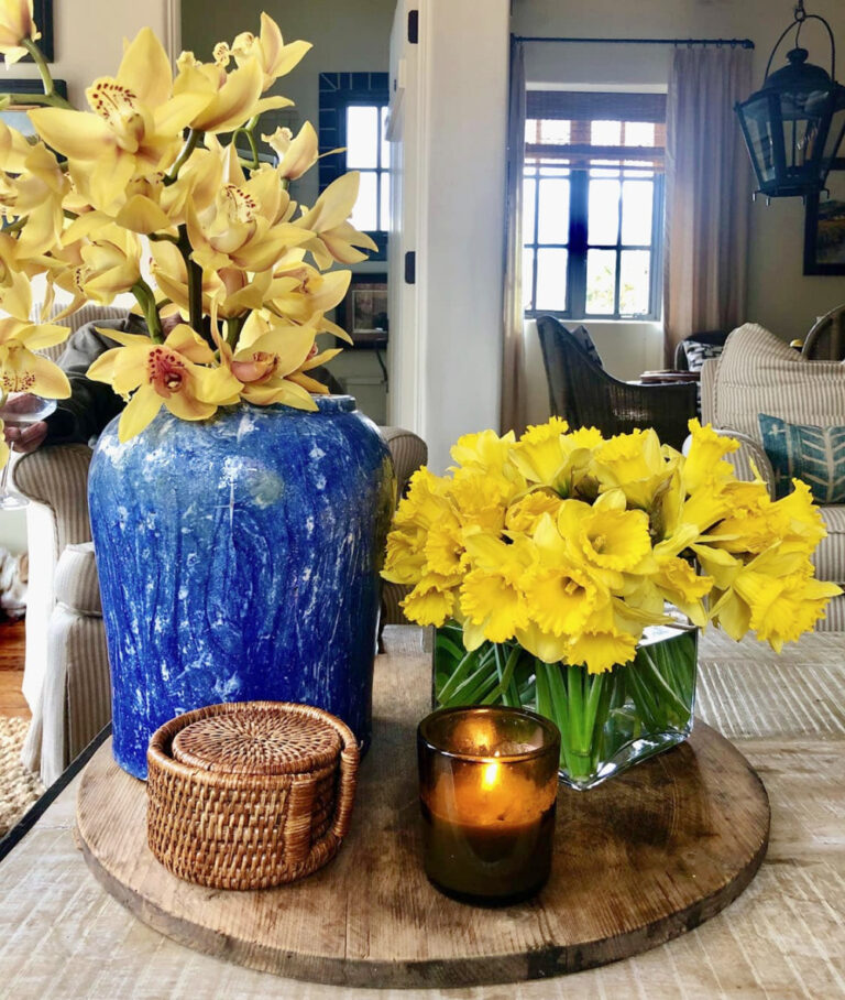 yellow flowers in blue vase and green vase on tray summer decor