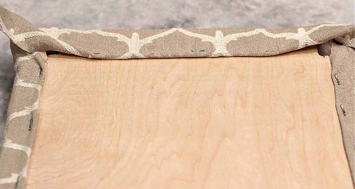 stapled back of seat for vintage stool