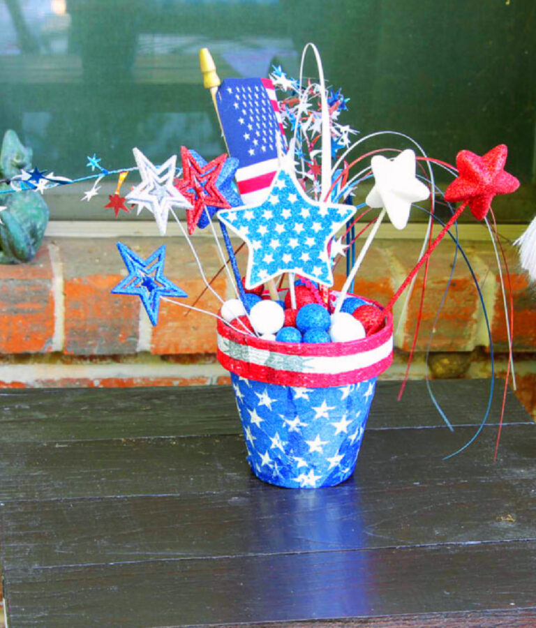 red white and blue decoupaged terra cotta pot decorated for 4th of July