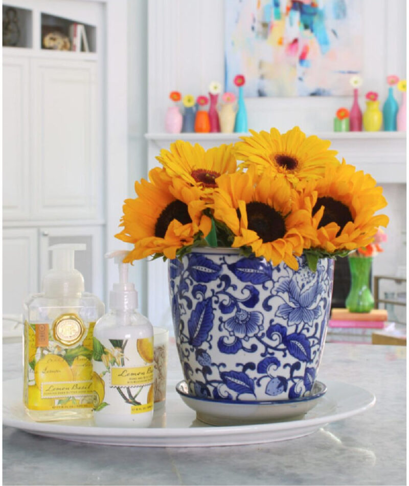chinoiserie vase filled with sunflowers