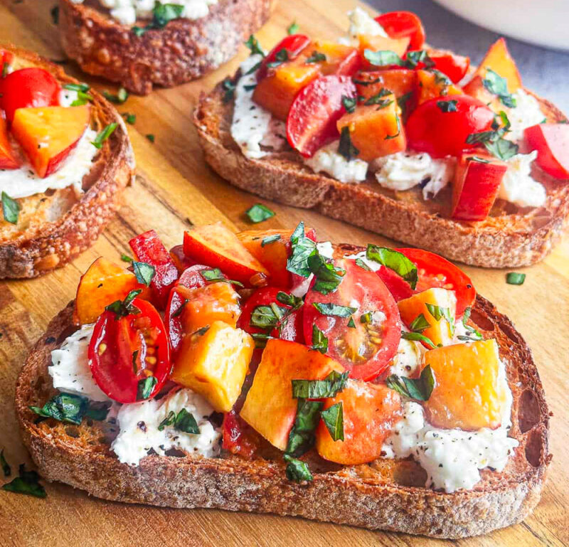 peach, tomato, pesto  and ricotta crostini