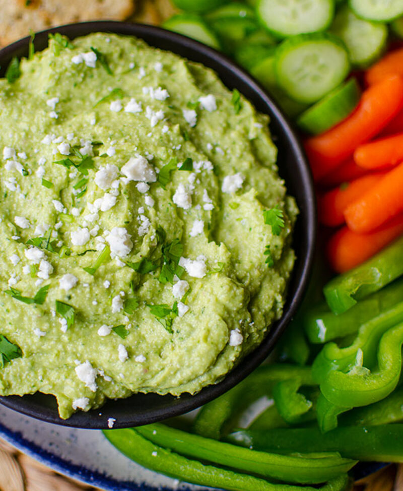 avocado and feta dip with sliced vegetables