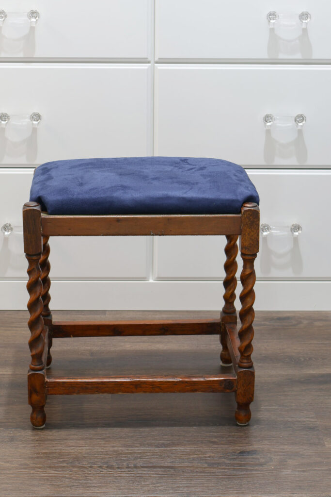 updated vintage stool with navy seat in closet