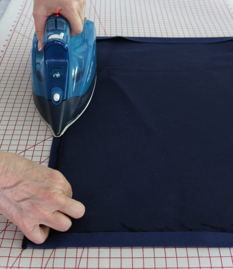 ironing the navy velvet fabric