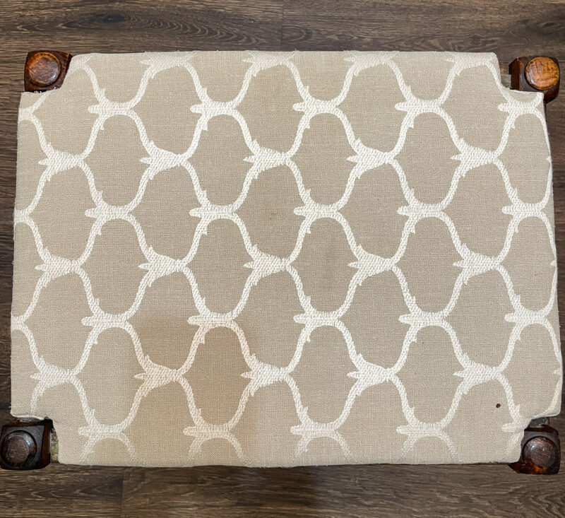 fabric top of seat of vintage stool