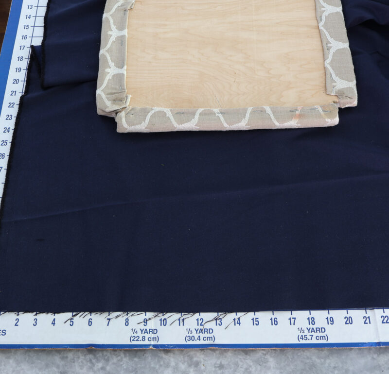 old stool seat on new navy fabric