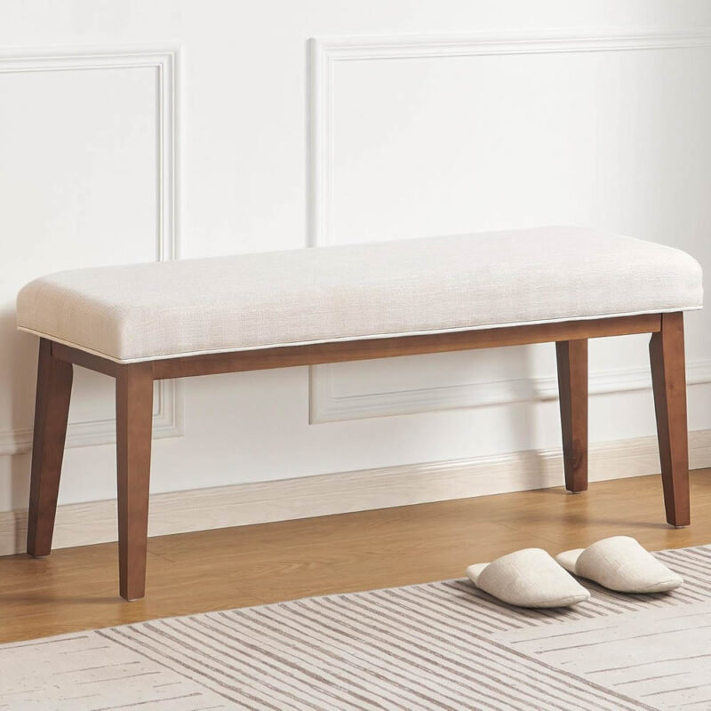 wood bench with cream upholstered seat
