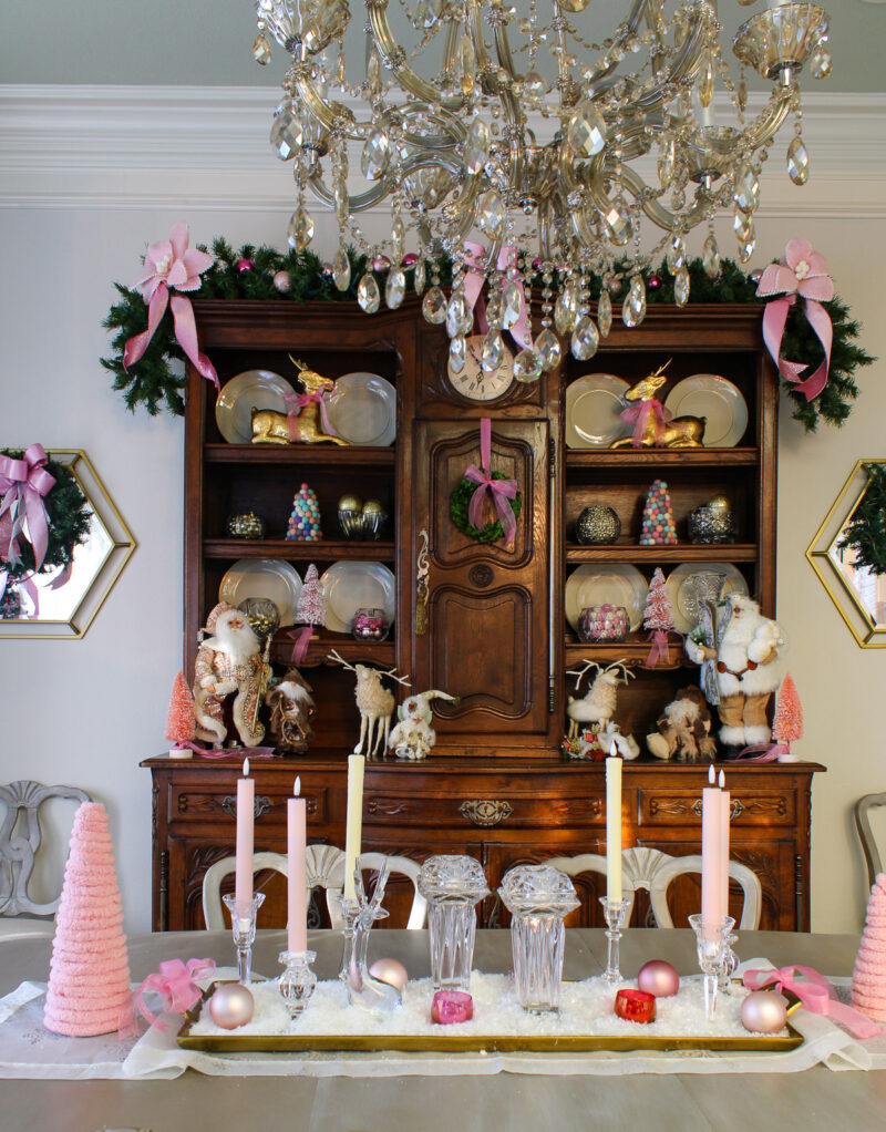 pink Christmas decorations on hutch