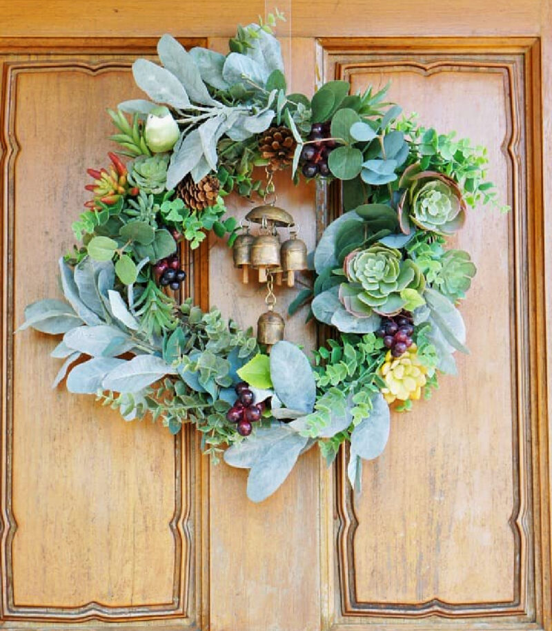 green succulent fall wreath on wood door