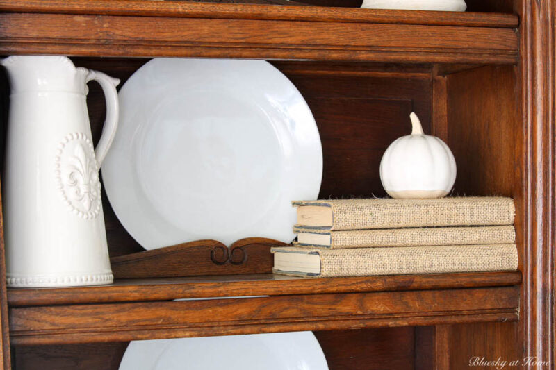 fall hutch decorating with white accessories