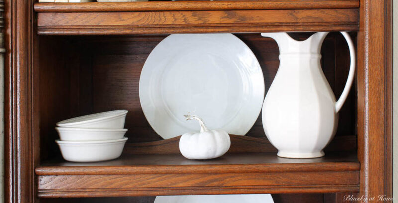 fall hutch decorating with white accessories