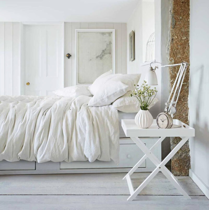 white bedroom with white linens