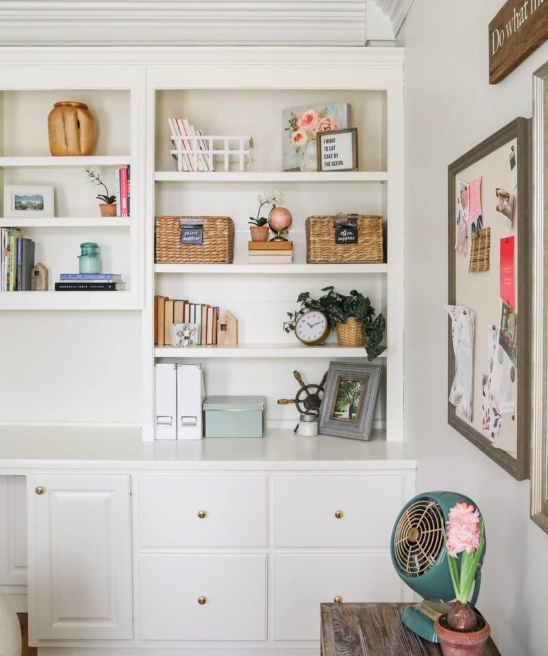 white bookcase with fall decorative accessories