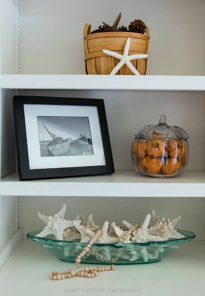 simple bookshelves using fall colors and basket