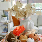 fall tray with pumpkins and vintage finds in tray