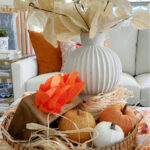 fall tray with pumpkins and vintage finds in tray