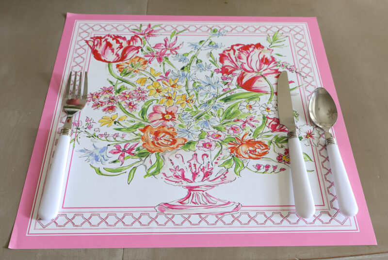 flower placemat with white handle utensils