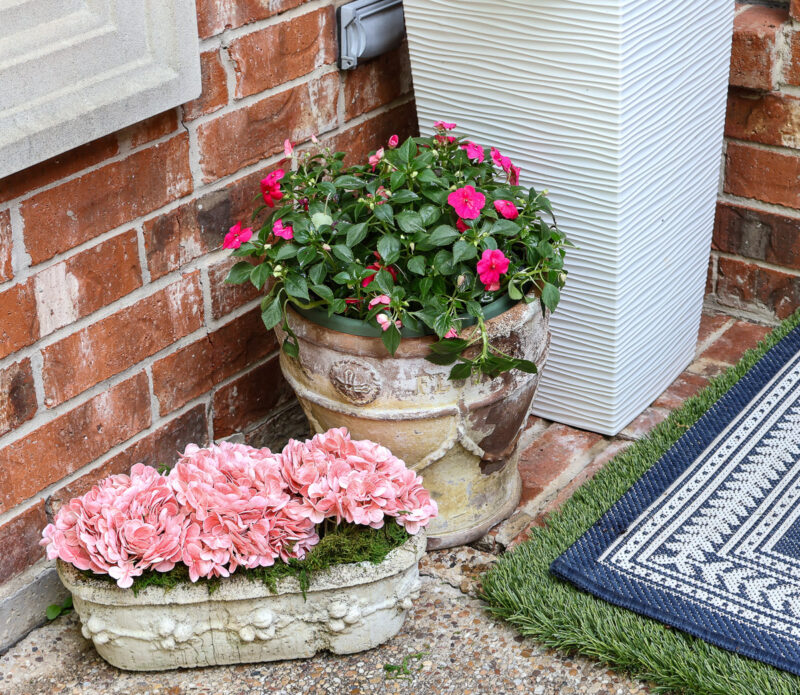 spring front door vignette with fresh and faux flowers